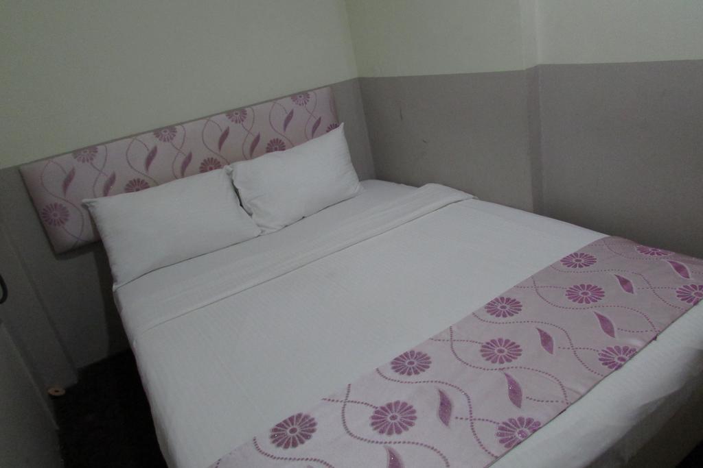 Meriton Hotel Szingapúr Szoba fotó